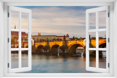 Charles Bridge in Prague in Czechia. Prague, Czech Republic. Charles Bridge (Karluv Most) and Old Town Tower. Vltava River and Charles Bridge. Concept of world travel, sightseeing and tourism.