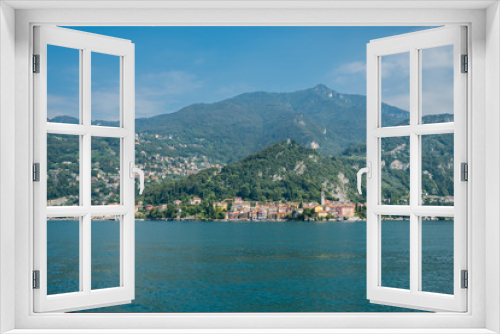 Fototapeta Naklejka Na Ścianę Okno 3D - Varenna, Italy sits beside Lake Como beneath forested mountains