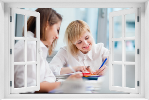 Two women working in an office