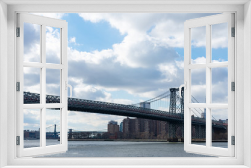 Fototapeta Naklejka Na Ścianę Okno 3D - The Williamsburg Bridge over the East River looking towards the Lower East Side of New York City
