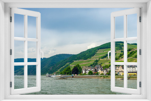 Fototapeta Naklejka Na Ścianę Okno 3D - Germany, Rhine Romantic Cruise, a large boat in a body of water with a mountain in the background
