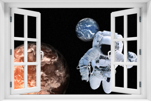 Fototapeta Naklejka Na Ścianę Okno 3D - Astronaut near Planets of solar system together in space. Earth and Mars, Science fiction wallpaper. Elements of this image were furnished by NASA.