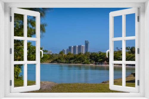 Fototapeta Naklejka Na Ścianę Okno 3D - city buildings blue sky sea beach water lake horizon architecture skyscraper florida green cityscape summer panorama
