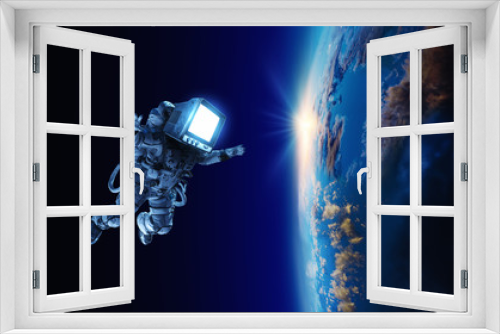 Fototapeta Naklejka Na Ścianę Okno 3D - Astronaut with TV head in space. Mixed media.