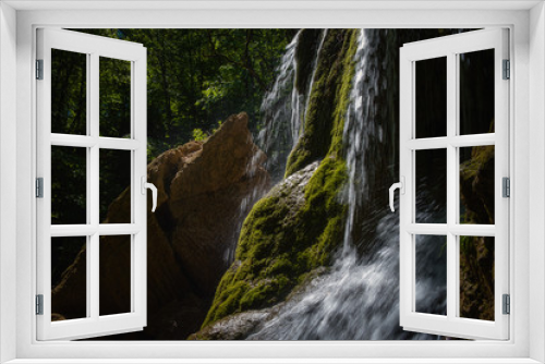 Fototapeta Naklejka Na Ścianę Okno 3D - A beautiful waterfall deep in the forest, steep mountain adventure in the rainforest.