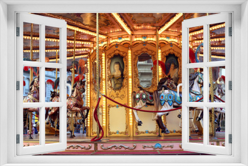 Fototapeta Naklejka Na Ścianę Okno 3D - Traditional classic French styled vintage colorful horse carousel in the town square