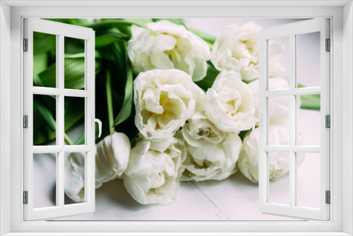 Fototapeta Naklejka Na Ścianę Okno 3D - Bouquet of white tulips on a wooden background with space for text. 