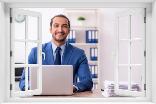 Young male businessman working in the office