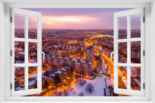 Fototapeta Naklejka Na Ścianę Okno 3D - Aerial city winter view with crossroads and roads, houses, buildings, parks. Helicopter drone shot. Wide Panoramic image. Kharkiv, Ukraine