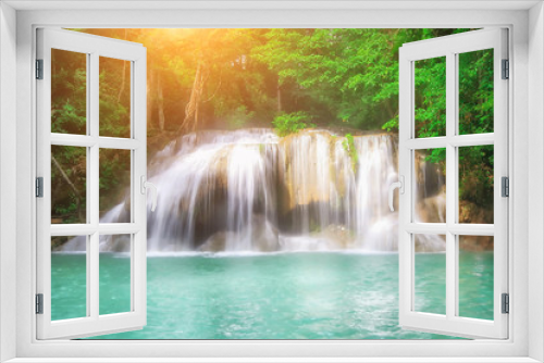 Fototapeta Naklejka Na Ścianę Okno 3D - The beautiful Erawan cascade waterfall with turquoise water like heaven and sunlight at the tropical forest ,Kanchanaburi National Park, Thailand