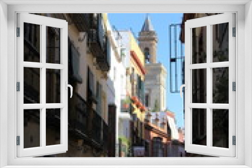 Fototapeta Naklejka Na Ścianę Okno 3D - An old narrow street in the center of Seville