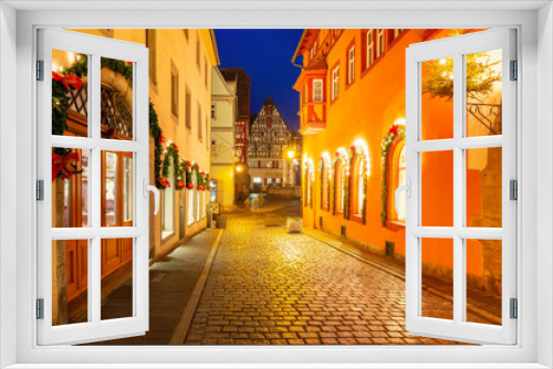Fototapeta Naklejka Na Ścianę Okno 3D - Decorated and illuminated Christmas night street in medieval Old Town of Rothenbur ob der Tauber, Bavaria, southern Germany