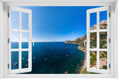 Fototapeta Naklejka Na Ścianę Okno 3D - Aerial view of coastline of the village of Nerano. Private and wild beaches of Italy. Turquoise, blue surface of the water. Vacation and travel concept. Boats on raid in bay. Copy space. Summer day