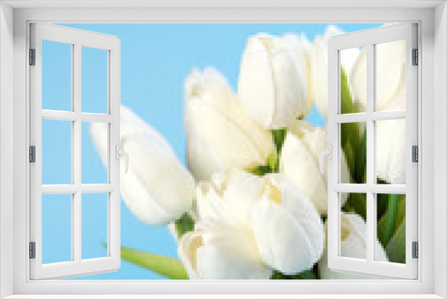 Fototapeta Naklejka Na Ścianę Okno 3D - Bouquet of spring tulip flowers on a light blue background. concept of spring and sunny mood. postcard. Copy space