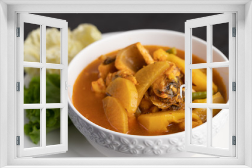 Fototapeta Naklejka Na Ścianę Okno 3D - Yellow curry with snakehead fish, Thai food in a bowl on a plate.