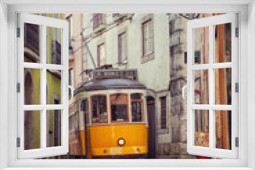 Fototapeta Naklejka Na Ścianę Okno 3D - Old vintage tram in a narrow street of Lisbon, Portugal