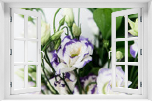 Fototapeta Naklejka Na Ścianę Okno 3D - Beautiful bouquet of spring flowers in vase. Floral composition of fresh white violet eustoma flowers. Gift. Celebration concept. Blooming flowers.  