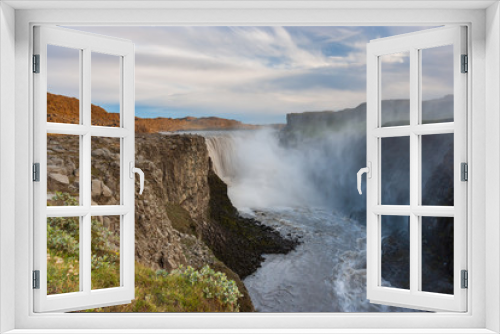 Fototapeta Naklejka Na Ścianę Okno 3D - Beautiful Icelandic waterfall at sunset with huge quantity of flowing waters Iceland