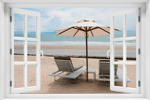 Fototapeta Naklejka Na Ścianę Okno 3D - two chairs and umbrella on the beach, vacation time after covid-19
