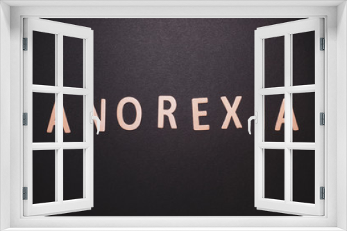 Anorexia word written on wood letters. anorexia text on table, concept