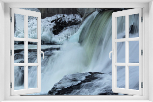 Fototapeta Naklejka Na Ścianę Okno 3D - Frozen waterfall flow from an electrical barrage