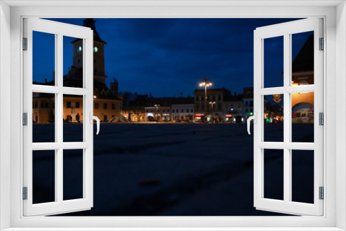 Fototapeta Naklejka Na Ścianę Okno 3D - Brasov's old city town square in the night, empty because of the coronavirus outbreak.