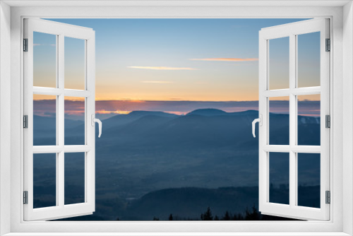 Fototapeta Naklejka Na Ścianę Okno 3D - sunrise sun hidden behind cloud in mountains with fog in valley