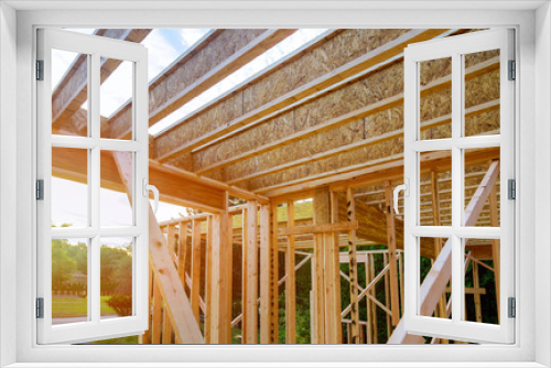 Fototapeta Naklejka Na Ścianę Okno 3D - Interior with wood framing beam of new house under construction beam wood
