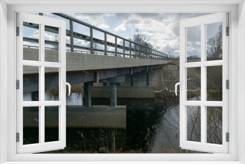 Fototapeta Naklejka Na Ścianę Okno 3D - concrete bridge over the river, spring day