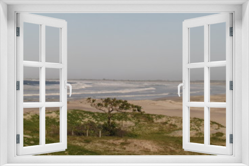 Fototapeta Naklejka Na Ścianę Okno 3D - Partial view of Praia Grande in dry foggy day.