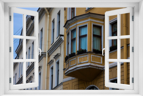 Fototapeta Naklejka Na Ścianę Okno 3D - Beautiful old facade with an unusual balcony