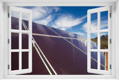 Fototapeta Naklejka Na Ścianę Okno 3D - Close up wide angle view of photovoltaic solar panels on an off the grid electricity instalation on a farm in the Karoo outside Touwsrivier in the western cape of south africa