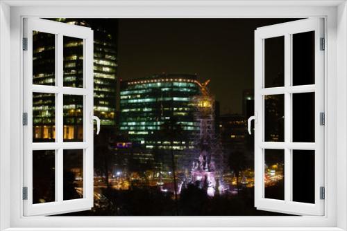 Fototapeta Naklejka Na Ścianę Okno 3D - Streets of Mexico City at night painted with golden lights illuminating the buildings in the city with a city landscape