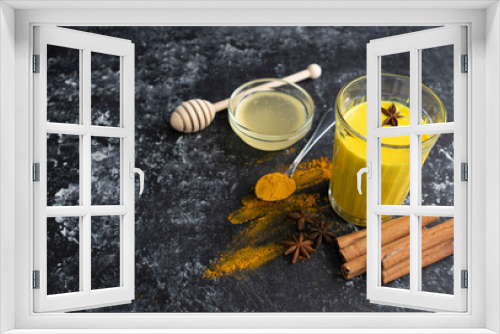Fototapeta Naklejka Na Ścianę Okno 3D - Indian hot drink with spices, latte with turmeric, Golden milk with honey top view