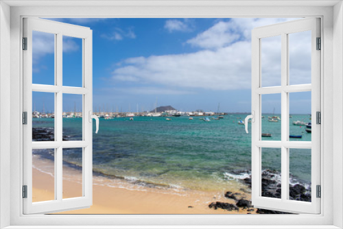 Fototapeta Naklejka Na Ścianę Okno 3D - Corralejo, Fuerteventura, Canary Islands, Spain: Boats and Yachts in Corralejo Port, calm ocean water 