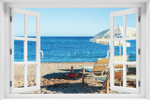 Fototapeta Naklejka Na Ścianę Okno 3D - Umbrella and longue chair at Chia beach Mediterranean sea