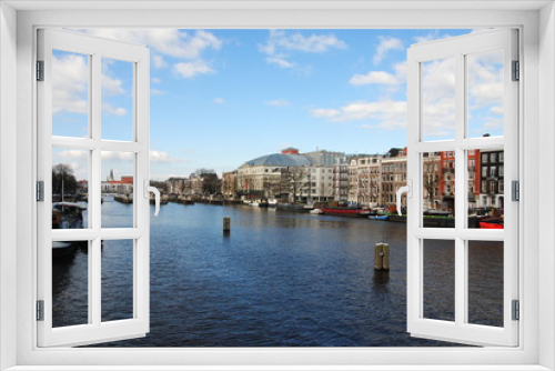Fototapeta Naklejka Na Ścianę Okno 3D - View over the Amstel river on the Amstel locks in the center of Amsterdam