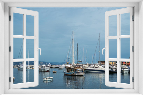 Fototapeta Naklejka Na Ścianę Okno 3D - Wide panoramic view of luxury yachts and sailing boats moored in harbor of Santa Margherita Ligure, Italian Riviera. Beautiful mediterranean landscape with cloudy blue sky.
