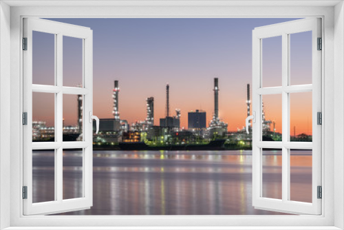 Fototapeta Naklejka Na Ścianę Okno 3D - Petrochemical industry factories and oil refineries, natural gas storage tanks industry, along with the sunset sky, oil transportation by boat