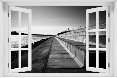 Fototapeta Naklejka Na Ścianę Okno 3D - Landscape Quay on the river bank in the European city concrete stairs to relax people black and white photo