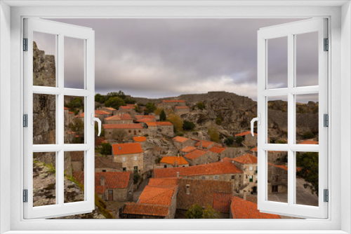 Fototapeta Naklejka Na Ścianę Okno 3D - View of the historic village of Sortelha on a very cloudy day It is one of historic villages of Portugal, located in Guarda district