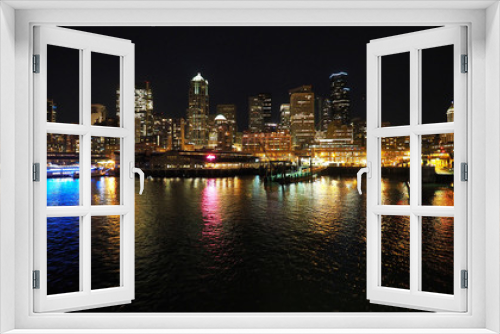 Fototapeta Naklejka Na Ścianę Okno 3D - Seattle, Washington - February 10, 2018 - Skyline of city of Seattle from Seattle - Bainbridge Island ferry at night.