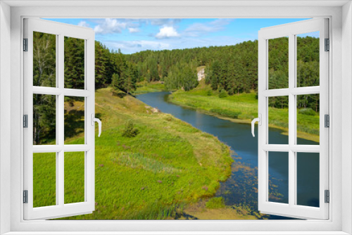 Fototapeta Naklejka Na Ścianę Okno 3D - landscape rotation of a river in a forest area against a blue sky