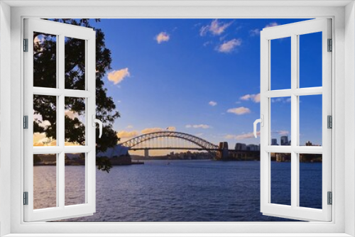 Fototapeta Naklejka Na Ścianę Okno 3D - Panorama View of Sydney Harbour bridge with blue and orange skies illuminating Sydney Harbour nsw australia view Luna park and opera house 