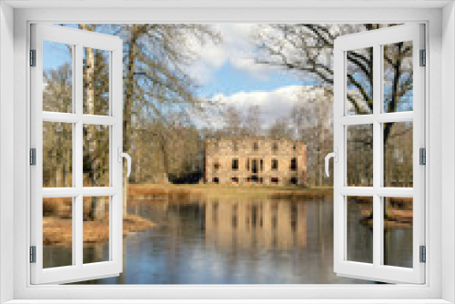 Fototapeta Naklejka Na Ścianę Okno 3D - wonderful landscape with old manor ruins, early spring, beautiful blue sky with white clouds, small pond with beautiful reflections of water