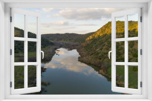 Fototapeta Naklejka Na Ścianę Okno 3D - Pulo do Lobo waterfall drone aerial view with river guadiana and beautiful green valley landscape at sunset in Mertola Alentejo, Portugal