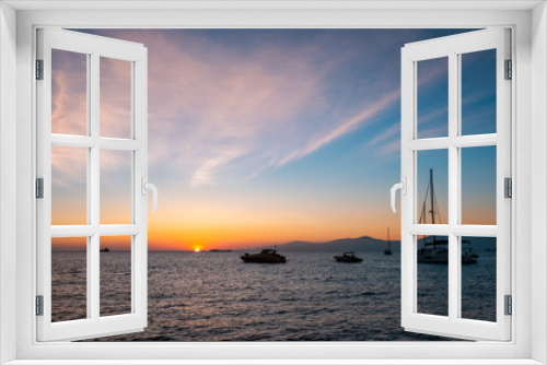 Fototapeta Naklejka Na Ścianę Okno 3D - Sunset in Mykonos island, Greece with yachts in the harbor romantic spot on sunset. Mykonos town, Greece
