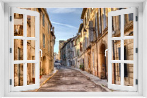 Fototapeta Naklejka Na Ścianę Okno 3D - Street with historical houses in Arles, France