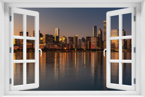 Fototapeta Naklejka Na Ścianę Okno 3D - Chicago Skyline Cityscape at night  with lake in front and  blue sky with cloud, Chicago, United state.