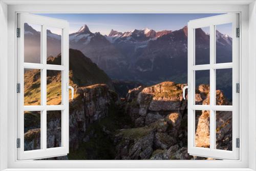 Fototapeta Naklejka Na Ścianę Okno 3D - Summer holiday season. Sunrise view on Bernese range above Bachalpsee lake. Highest peaks Eiger, Jungfrau and Schreckhorn in famous location. Switzerland alps, Grindelwald valley. Travel background